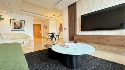a living room with a large flat screen tv at Penthouse View 2BR Terrace - AppartAli Luxury Platform in Casablanca