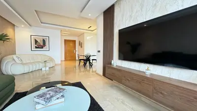 a living room with a large flat screen tv at Penthouse View 2BR Terrace - AppartAli Luxury Platform in Casablanca