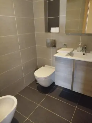 a bathroom with a toilet and a sink at Appartement de luxe Rabat Prestigia in Rabat