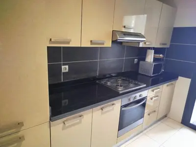 a small kitchen with a stove and a microwave at Appartement de luxe Rabat Prestigia in Rabat