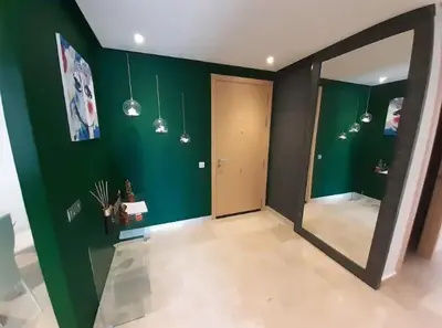 an empty room with green walls and a door at Appartement de luxe Rabat Prestigia in Rabat