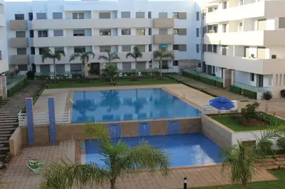 a large swimming pool in front of a building at Paradise 11 in Pont Blondin