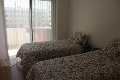 a hotel room with two beds and a window at Paradise 11 in Pont Blondin