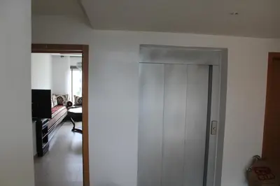 a hallway with a white door in a room at Paradise 7 in Pont Blondin