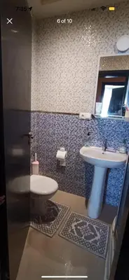 a bathroom with a sink and a toilet at الشقة دار بوعزة in Dar Bouazza