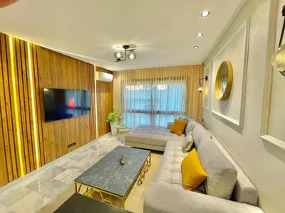 a living room with a couch and a table at E19 Appt Moderne & Calme à Maarif ,Casablanca in Maarif