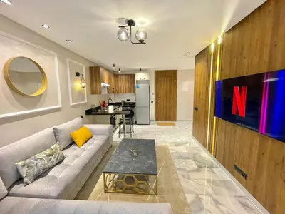 a living room with a couch and a table at E19 Appt Moderne & Calme à Maarif ,Casablanca in Maarif