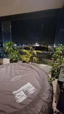 a gray tent sitting in front of a window at night at luxury Studio with jacuzzi in Casablanca