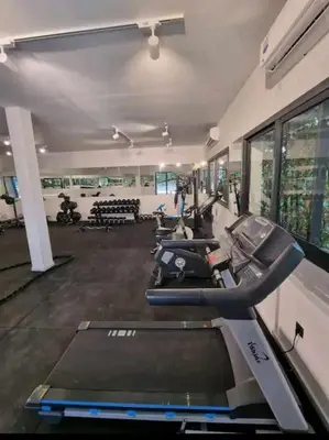 a gym with a row of treadmills and machines at luxury Studio with jacuzzi in Casablanca