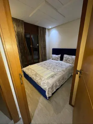 a bedroom with a bed in a room at Appartement vue sur mer in Casablanca