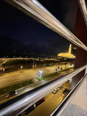 a view of a highway at night from a window at Appartement vue sur mer in Casablanca
