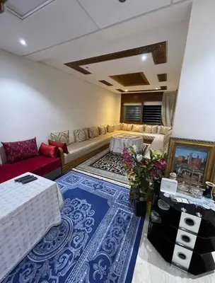 a living room with a couch and a table at Appartement vue sur mer in Casablanca