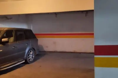 a parking garage with a car parked in it at Spacious Beachfront apartment in Casablanca