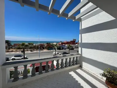 a balcony with a view of the ocean at Superbe Villa Avec Piscine & Belle Vue Sur Mer in Tamaris