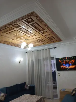 a living room with a coffered ceiling and a couch at xxxxxxxcccc in Mohammedia