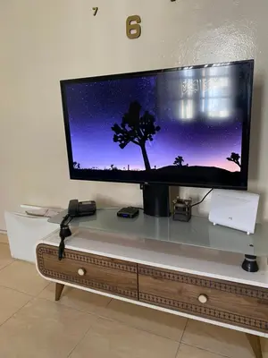 a flat screen tv sitting on top of a table at Magnifique Studio Gare - Tram in Les Camps