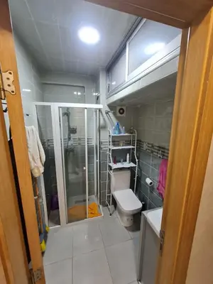 a bathroom with a shower and a toilet at Appartement perle de bouznika in Kasba Bou Hamira