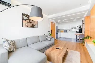a living room with a couch and a table at Modern and Luxurious apartment in Rabat