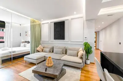 a living room with a couch and a table at Modern Elegance in City Core in Gare de Rabat-Aguedal