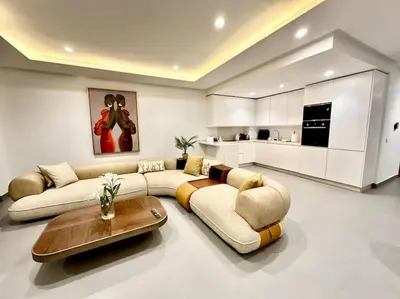 a living room with a couch and a table at Appartement Luxueux Spacieux & une Vue Panoramique in Casablanca