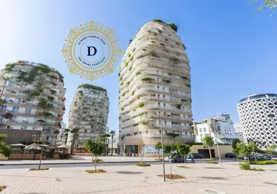 a rendering of two tall buildings in a city at Les Tours Végétales, Casablanca Finance City in Casablanca