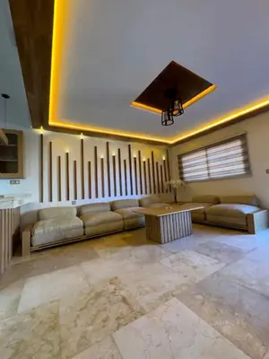 a large living room with a couch and a table at Casa Jnane Jawhara Skhirat in Rabat