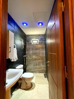 a bathroom with a toilet and a sink and a shower at Casa Jnane Jawhara Skhirat in Rabat