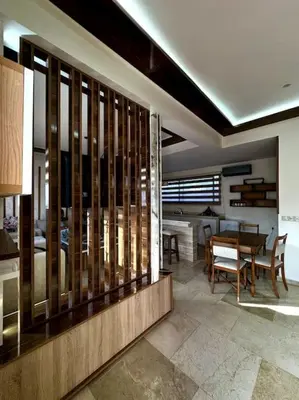 a living room with a table and a dining room at Jnane Jawhara Skhirat house in Skhirat