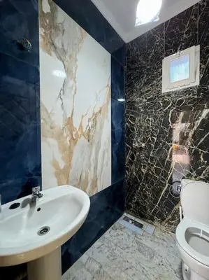 a bathroom with a sink and a toilet at Jnane Jawhara Skhirat house in Skhirat