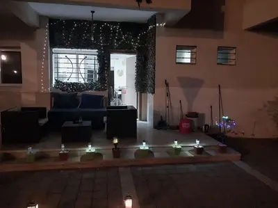 a living room with a couch and christmas lights at vague bleue de bouznika in Bouznika