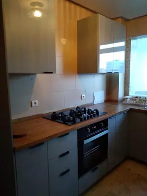 a kitchen with a stove and wooden counter top at Appartement in Casablanca