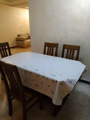 a table with a white table cloth on it at Appartement in Casablanca