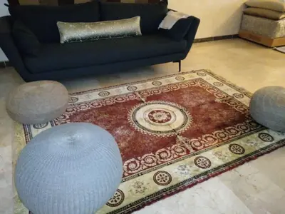 a living room with a couch and a rug at Appartement in Casablanca