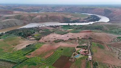 an aerial view of a river and a field at Kasbah Oum Rabia in Boulaouane