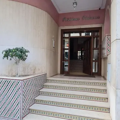 a building with stairs in front of a door at Appartement confortable et bien situé in Casablanca