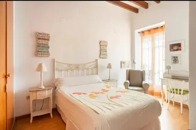 a bedroom with a bed and a desk and a chair at Maison du bonheur in Casablanca