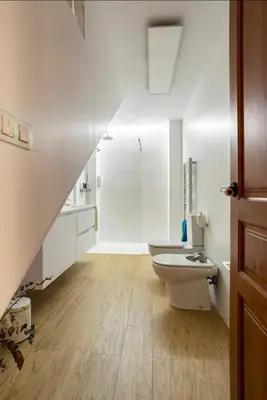 a white bathroom with a sink and a toilet at Maison du bonheur in Casablanca