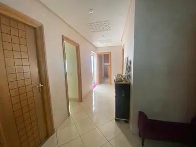 a hallway with a room with a door and a hallwayngthngthngthngthngth at duplex in Oulad Lahsene