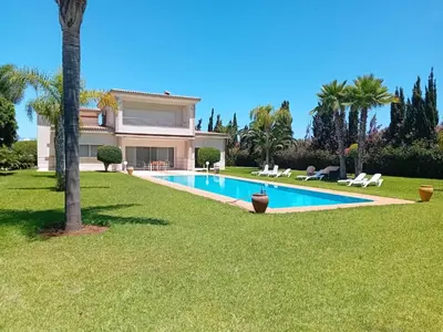 a house with a swimming pool in a yard at Superbe villa à Bouznika in Bouznika