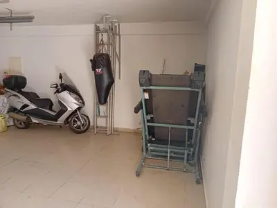 a room with a scooter parked in a room at Superbe villa à Bouznika in Bouznika
