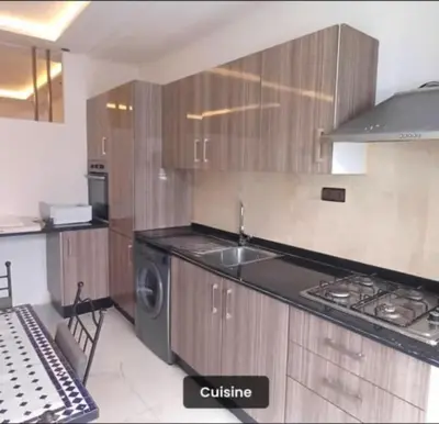 a kitchen with a stove and a sink and a dishwasher at Luxury apartment in Casablanca