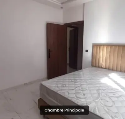a bedroom with a large bed in a room at Luxury apartment in Casablanca