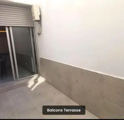 a sign in front of a building with a window at Luxury apartment in Casablanca