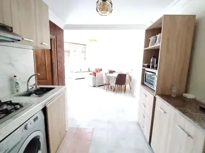 a kitchen with a stove and a dishwasher at Joli Apparemment et calme in Casablanca