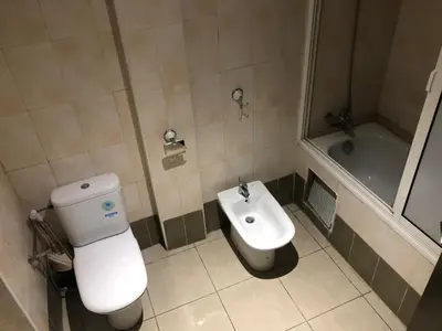 a bathroom with a toilet and a sink and a tub at Casablanca in Casablanca