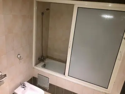 a bathroom with a shower and a tub and a sink at Casablanca in Casablanca