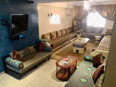 a living room with couches and a flat screen tv at Casablanca in Casablanca