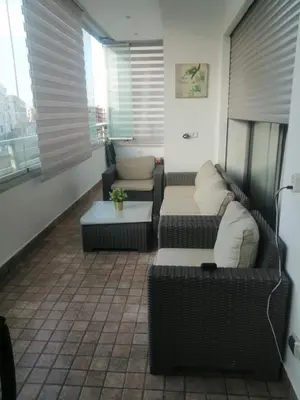 a living room with two couches and a table at Appartement Confortable en Résidence Privée avec Piscine in Pont Blondin