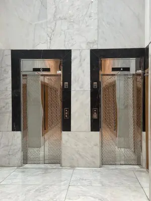 two elevators in a building with their doors open at AS140 élégant coeur de Casablanca avec Wifi Parking et Tramway in Casablanca