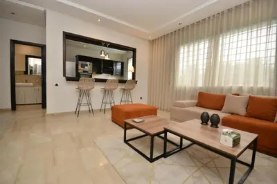 a living room with a couch and a table at Lovely 2 bedroom flat in Ain Diab in Casablanca